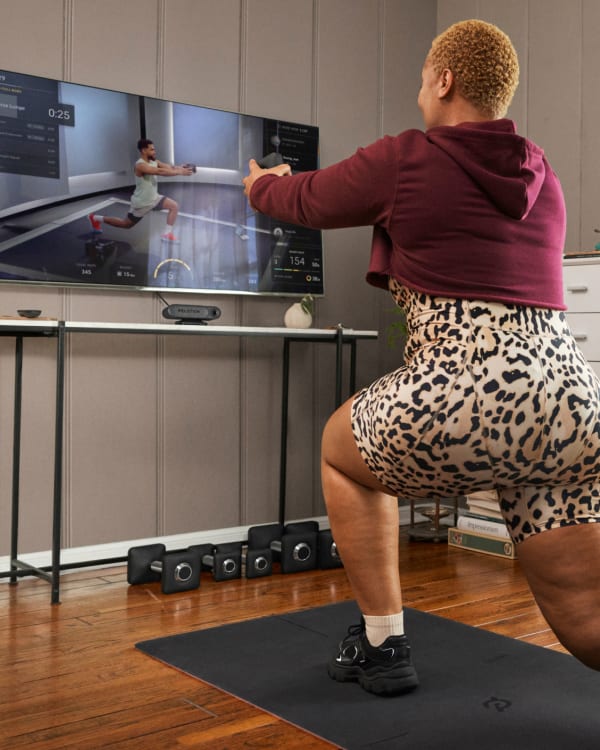 Peloton Member working out with the Guide